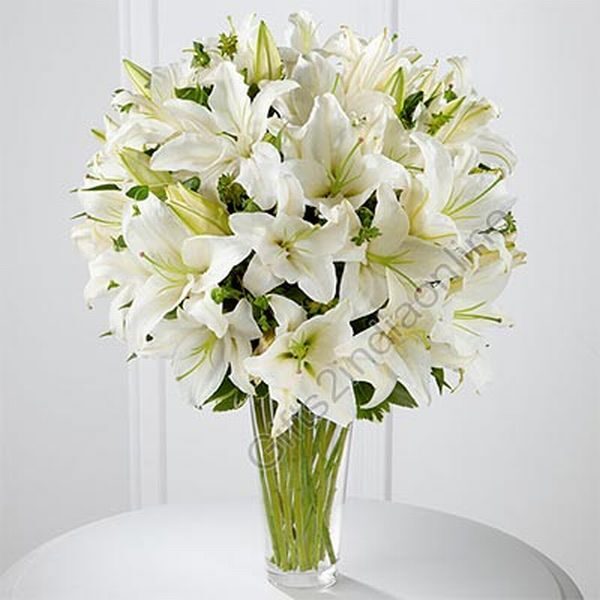 white Lilies in a Clear Glass Vase